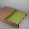 Set de table en papier vert anis vendu en boîte distributrice