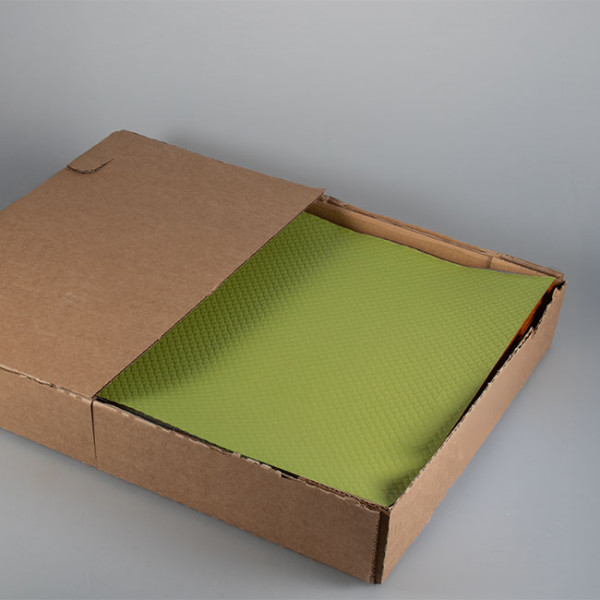 Set de table en papier vert anis vendu en boîte distributrice
