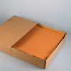 Set de table en papier orange vendu en boîte distributrice