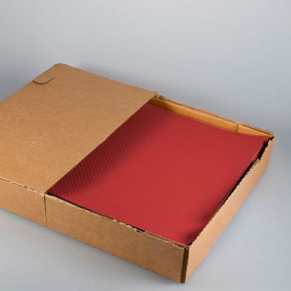 Set de table en papier rouge vendu en boîte distributrice